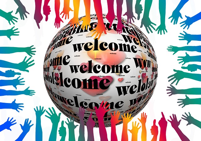 Welcome globe and multi-coloured hands