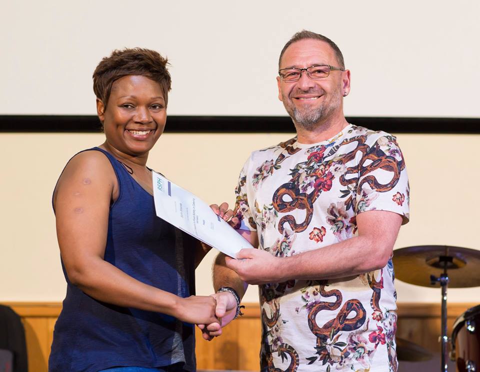 Global Kitchen graduate Sipho Sibanda receives certificate from Urban Community Chef Mark Humphries. Photo: Rashid Kaidanov