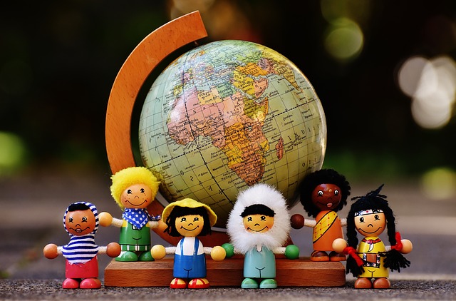 Dolls of different nationaliities and globe